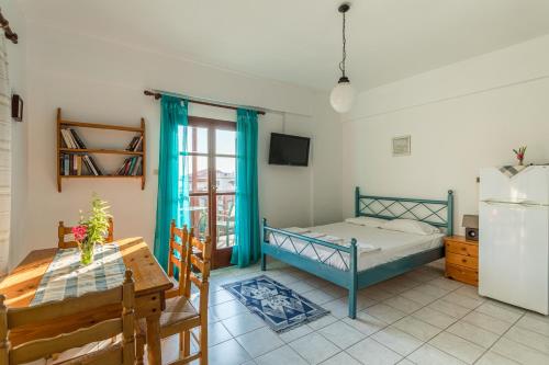 Postel nebo postele na pokoji v ubytování Penelope Apartments