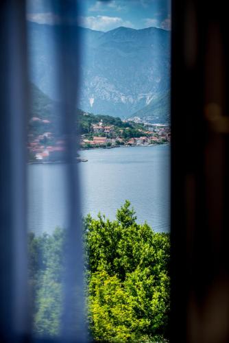 a view of a lake from a window at Montefiori Lux View Apartment in Kotor