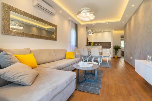 a living room with a couch and a table at Montefiori Lux View Apartment in Kotor
