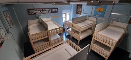 an overhead view of three bunk beds in a room at Santander Central Hostel in Santander