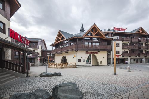 a large building in the middle of a street at Ski-Inn RukaVillage in Ruka