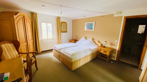 Postel nebo postele na pokoji v ubytování Hotel Erbgericht