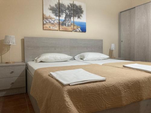 Postel nebo postele na pokoji v ubytování Hotel Medousa