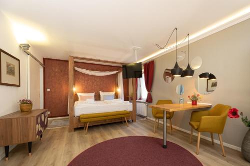 Postel nebo postele na pokoji v ubytování Little Suite Apartments