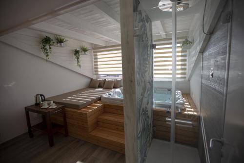 a small room with two beds and a window at Luxmarì Hotel & Spa in Castellammare del Golfo