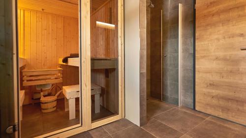 a bathroom with a shower and a sink at UplandParcs Winterberg in Winterberg