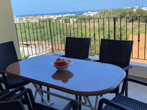 a bowl of fruit on a table on a balcony at Kyklades Resort & Spa in Paralimni