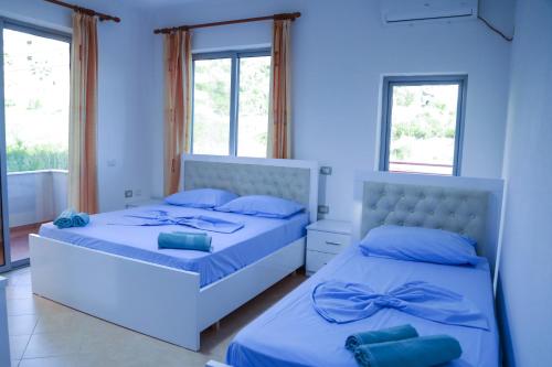 Llit o llits en una habitació de Vila Namiku