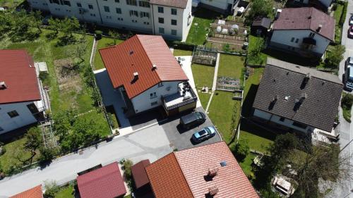 an overhead view of a house with red roofs at Apartment and room Anica in Tolmin