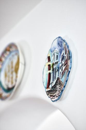 two rings with a picture of a building at Cinco Suites in Kithnos