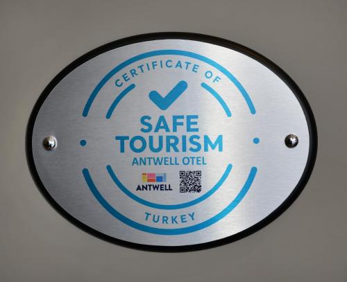 a metal plate with a safe tourism sign on it at Antwell Suites in Istanbul