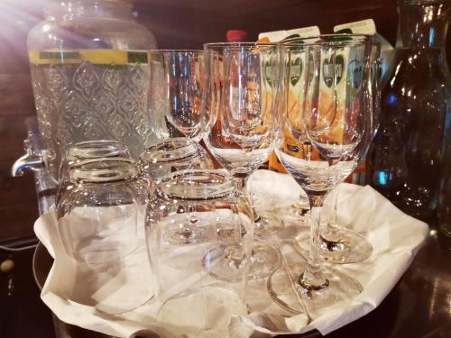 a group of wine glasses sitting on a table at Pension Almhof Baumgarten in Bad Reichenhall