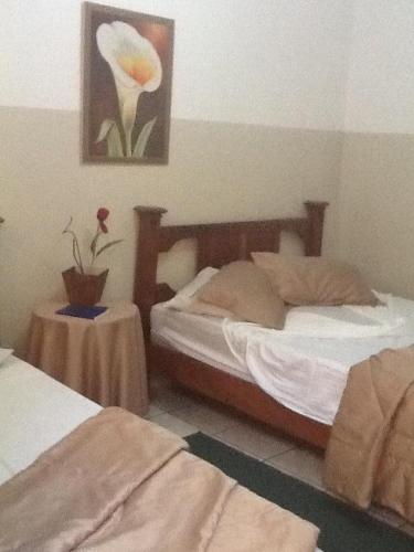 Una cama o camas en una habitación de Hotel Cadore