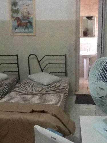 Una cama o camas en una habitación de Hotel Cadore