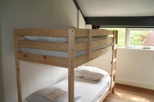 a couple of bunk beds in a room at Rekerlanden 14 in Schoorldam