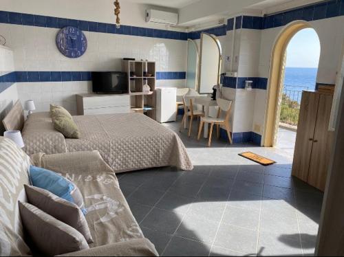 Posteľ alebo postele v izbe v ubytovaní SUITE ISOLA BELLA