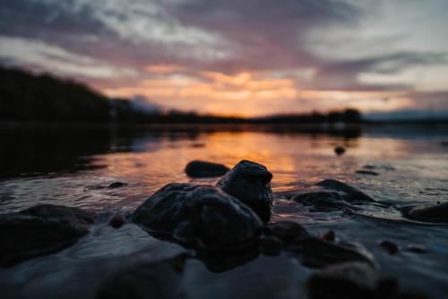 a rock sitting on top of a body of water at Shieldaig Lodge Hotel in Gairloch