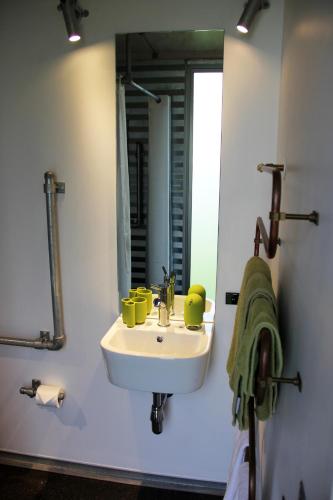 a bathroom with a sink and a mirror at SiloStay in Little River