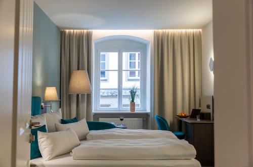 Postel nebo postele na pokoji v ubytování Altstadthotel der Patrizier