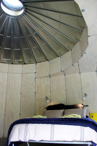 a room with a bed in a tent at SiloStay in Little River