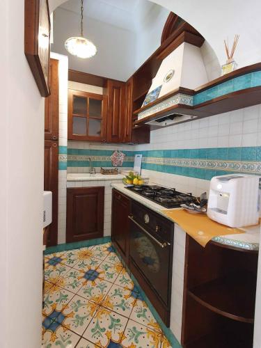 Una cocina o zona de cocina en Profumo di Limoni