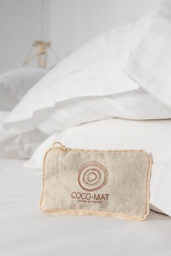 a wallet sitting on top of a pile of papers at Michalakis Seaside Suites in Pollonia