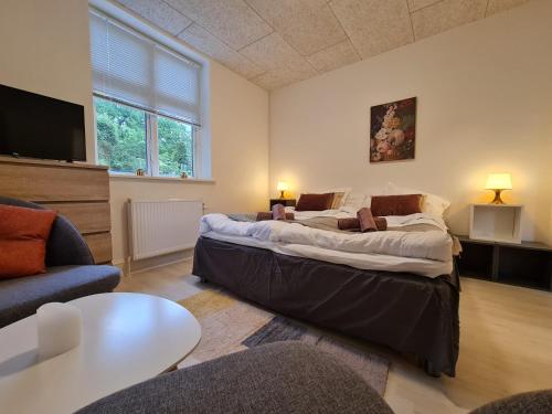 Voodi või voodid majutusasutuse Hotel Stokkegaarden's BnB & Apartments toas