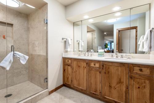 a bathroom with a double sink and a shower at 326 Kiva Condo access to Ski in Out in Avon