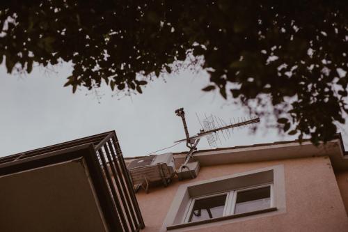 a window on a building with a satellite at Perla Apartments in Poreč