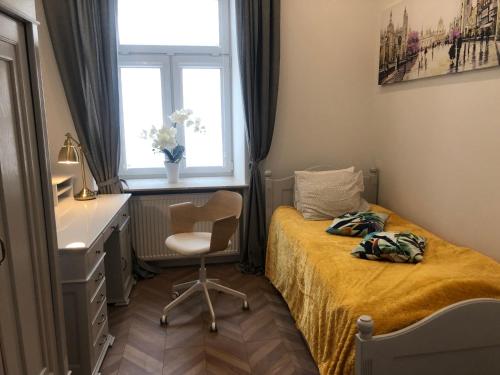 Säng eller sängar i ett rum på #VisitLublin Apartments City Center Narutowicza