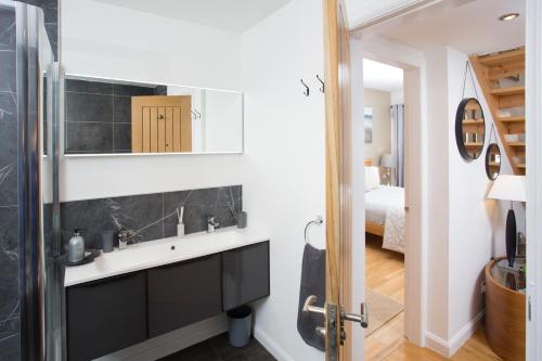 a bathroom with a sink and a mirror at Fishermans in Inverness