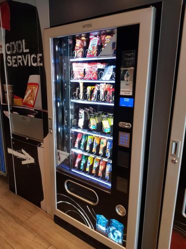 a vending machine with food and drinks in it at Ibis Budget Marseille Vitrolles in Vitrolles