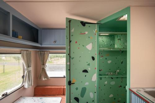 a climbing room in a caravan with a climbing wall at Beverley Thrills Caraglamping in Stratford-upon-Avon