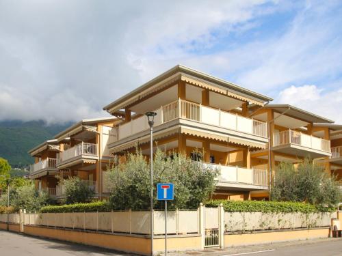 a large building with a fence in front of it at Apartment Il Piccolo by Interhome in Toscolano Maderno