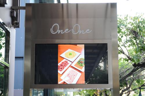 a sign for a one one restaurant at One One Bangkok in Bangkok