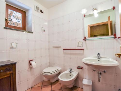 a bathroom with a toilet and a sink at Chalet Cesa Galadriel-1 by Interhome in Penia