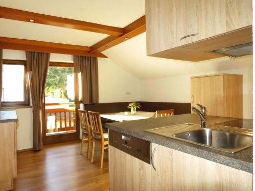 a kitchen with a sink and a counter top at Apartment Alpenblick - SOE750 by Interhome in Sölden