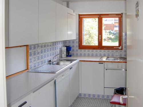 Kuchyň nebo kuchyňský kout v ubytování Apartment Panoramic G4 by Interhome