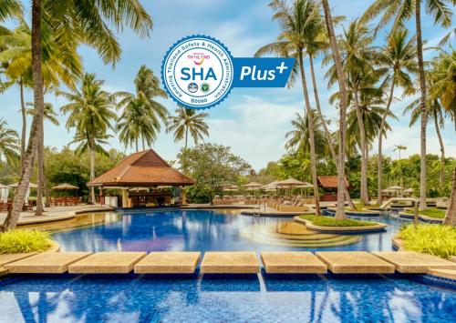 a swimming pool at the resort with the shka pust logo at Banyan Tree Phuket in Bang Tao Beach