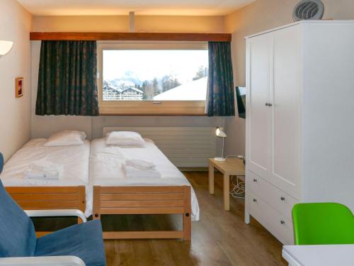 Cama o camas de una habitación en Apartment Rosablanche C66 by Interhome