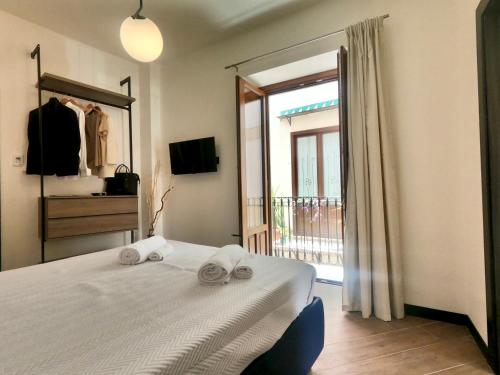 Ένα ή περισσότερα κρεβάτια σε δωμάτιο στο Ponticello Apartments