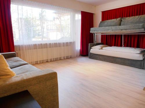 a living room with two bunk beds and a couch at Apartment Andrea B15 by Interhome in Vermala