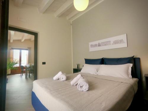 Ένα ή περισσότερα κρεβάτια σε δωμάτιο στο Ponticello Apartments