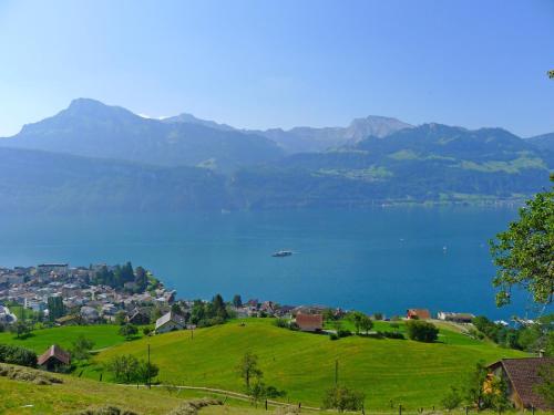 a view of a lake with a boat in the water at Apartment Platten by Interhome in Gersau