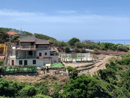 a house sitting on top of a hill at Casa Oleandri in Tresnuraghes