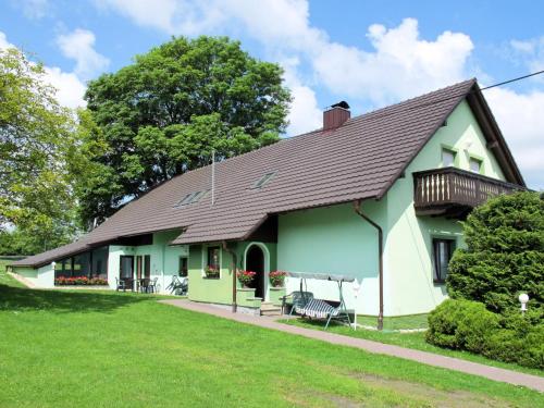a green and white house with a brown roof at Holiday Home Haus Polivka by Interhome in Třebíšov
