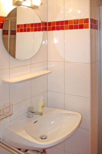 a bathroom with a white sink and a mirror at Apartment Gasthof Almluft-6 by Interhome in Stummerberg
