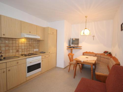 A kitchen or kitchenette at Apartment Gasteighof-4 by Interhome