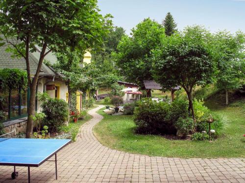 a blue ping pong table in front of a house at Holiday Home Karasova III by Interhome in Dehtáře