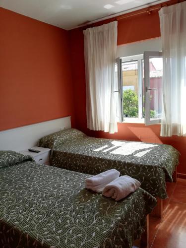 Ένα ή περισσότερα κρεβάτια σε δωμάτιο στο O Encontro